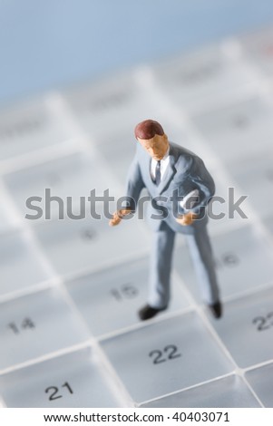 The businessman who stands on the schedule calendar.