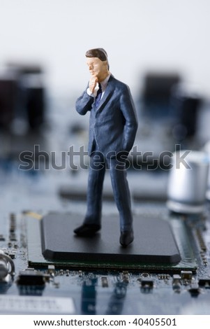 Doll of the businessman who pauses in the electronic machine.