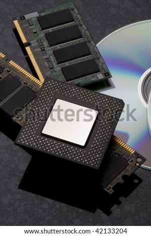 Computer CPU, rams and DVD on black background