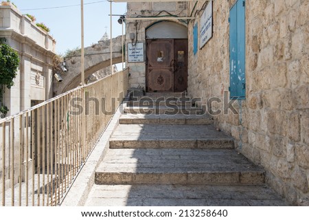 JERUSALEM,ISRAEL - JULY 25: Via Dolorosa on July 25,2014 in Jerusalem.The way in Old City of Jerusalem, held to be the path that Jesus walked, carrying his cross, on the way to his crucifixion.