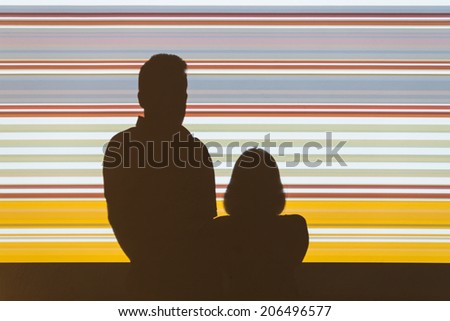 Shadow man and woman on a light colored background