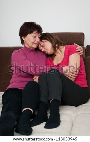 Big troubles - senior mother comforts daughter