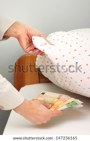 Woman hides money under pillow