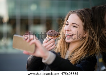 Similar – Image, Stock Photo Taking photos of donuts with the smartphone. Photographing food top view.