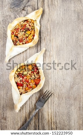 Pide, also known as Pita in some countries, is a dish similar to pizza, typically served as a part of Turkish, Armenian and Middle-Eastern cuisines. Copy space