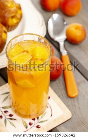 Orange drink on wooden table, selective focus