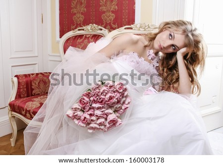 Sad bride sitting in luxurious palace