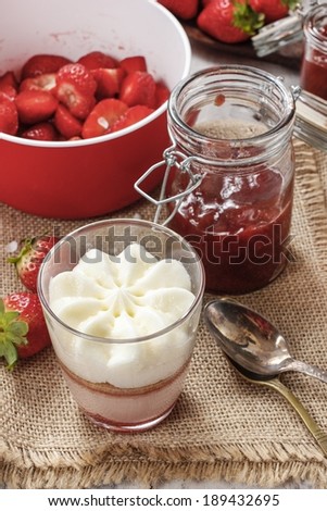 Layer strawberry dessert with whipped cream topping