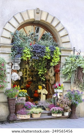 KRAKOW,POLAND - SEPTEMBER 21,2014: Entrance to the florist\'s shop decorated with flowers and plants.