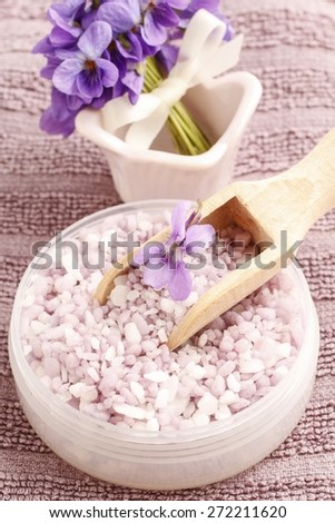 Sea salt with viola flowers (viola odorata)