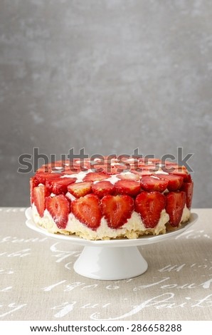 Strawberry cake on cake stand, copy space