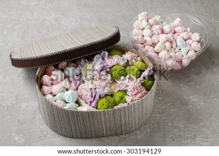 Box of sweets and flowers