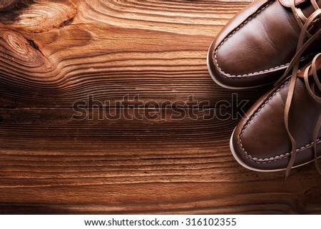 Man's collection:  tie, shoes on a wooden background