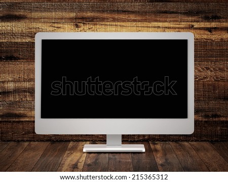 Monitor on old wood surface