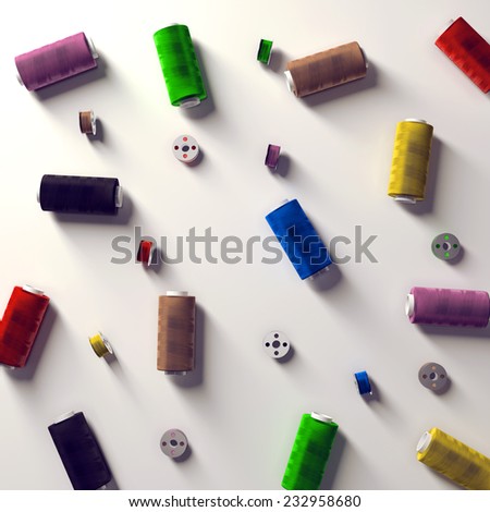 A selection of coloured spools and bobbins of thread/yarn arranged on a white background