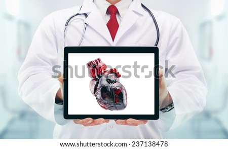 Doctor with heart  in hands in a hospital