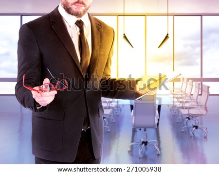 Hipster business man with digital tablet on blurred background office. High resolution.