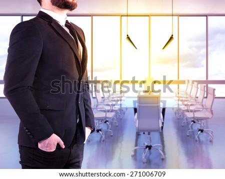 Hipster business man on blurred background office. High resolution.