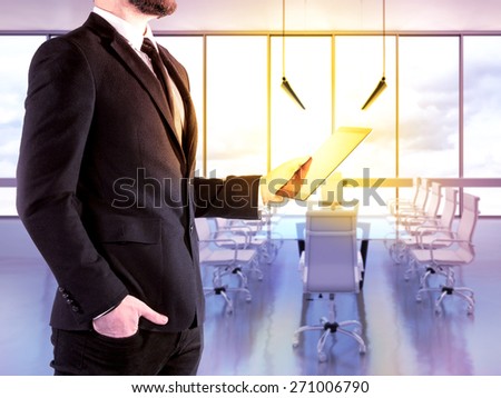 Hipster  business man with digital tablet on blurred background office. High resolution.