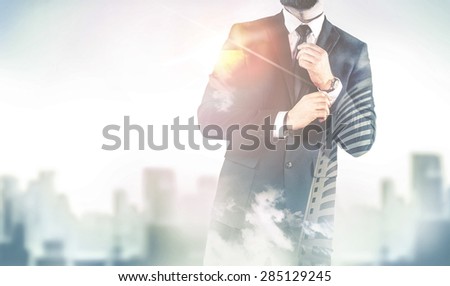 Double exposure of city and business man