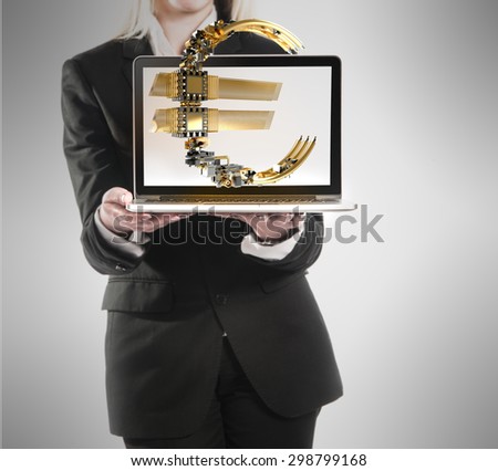 Businesswoman with laptop and euro sign in hand on gray background