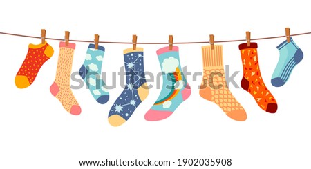 Socks on rope. Cotton or wool sock dry and hang on laundry string with clothespins. Children socks with textures and patterns vector cartoon. Illustration wool and cotton socks in rope