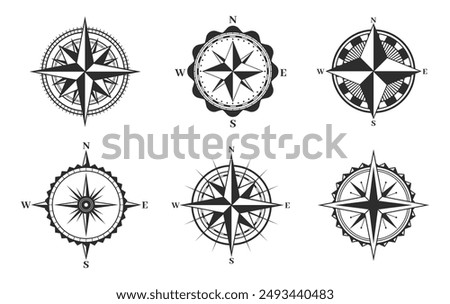 Compass icons set. Navigation compass wind rose retro signs, cartography, journey and adventure symbol. Monochrome outline vintage maritime compasses navigational vector emblems.