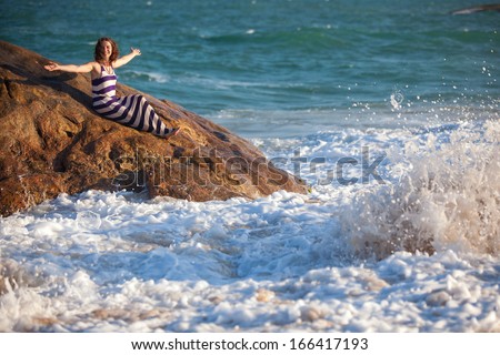 Woman takes rest at the sea shore