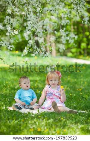 boy and girl plays in park
