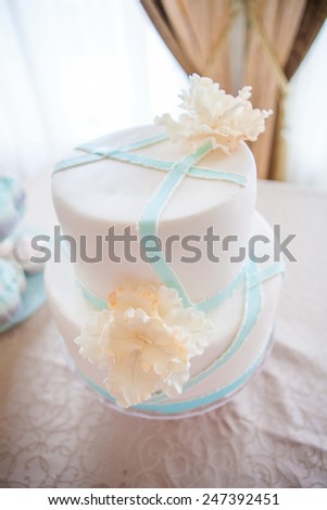 wedding cake with individual decoration at withe table