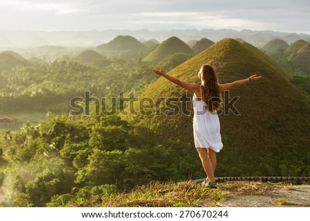 woman doing yoga in The Chocolate Hills. Bohol, Philippines