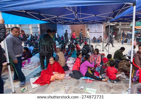 KATHMANDU, NEPAL - APRIL 26, 2015: Frightened people and homeless stay at the open spaces and squares of Kathmandu after 7.8 earthquake