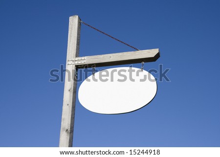 Empty wooden post and sign