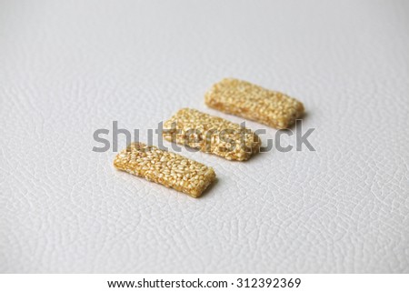 sugar bar with sesame and peanut from china food isolated on white