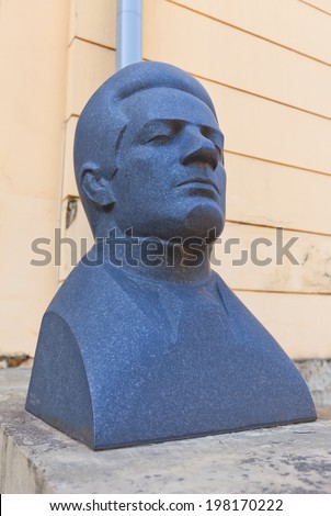 Riga, Latvia - May 25, 2014: Sculpture portrait of Emils Darzins, Latvian composer, music critic and pedagogue. Facade of Exhibition hall Arsenals in Riga, Latvia. Work of sculptor Marta Lange, 1975