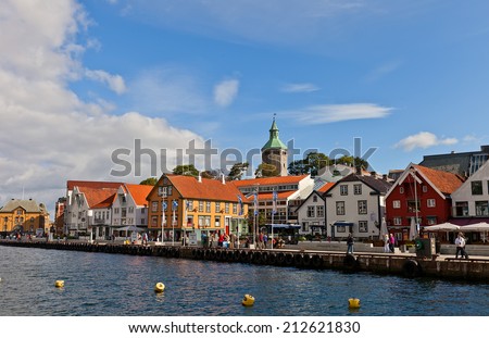STAVANGER, NORWAY - AUGUST 16, 2014: Old houses (circa XIX c.) on Skagenkaien street (part of Blue Promenade) of historic center of Stavanger, Norway. Buildings are former wharf warehouses