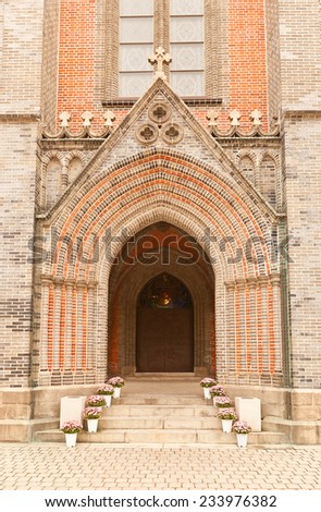 SEOUL, KOREA - SEPTEMBER 28, 2014: Entrance portal of Myeongdong Cathedral of Virgin Mary of Immaculate Conception (1898) in Seoul, Korea. Seat of Archbishop of Seoul, National Historic Site No258