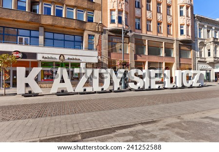 LODZ, POLAND - OCTOBER 19, 2014: Huge white letters KAZDY SIE LICZY (Everyone counts) on Piotrkowska Street in Lodz, Poland. Photo exhibition commemorates the 100th anniversary of the Polish Legions
