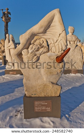 MOSCOW, RUSSIA - JANUARY 06, 2015: Limestone sculpture Playing with a Bull in Muzeon Art Park in Moscow, Russia. Sculptor Shcherbakov, 1998