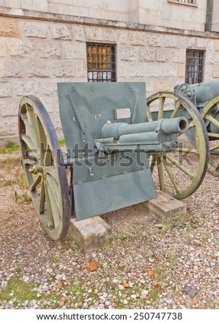 WARSAW, POLAND - OCTOBER 20, 2014:  French 75 mm field gun model 1912 in Museum of Polish Army in Warsaw, Poland. Produced by Schneider Factory in Creusot
