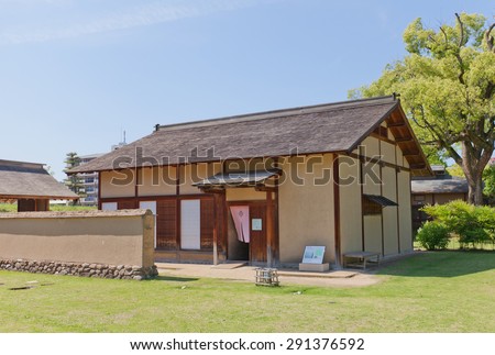MATSUYAMA, JAPAN - MAY 21, 2015: First of two reconstructed samurai houses (Buke Yashiki) in Dogo Park (former Yuzuki castle) of Matsuyama, Japan. Yuzuki castle was erected in 1338, abandoned in XVI c