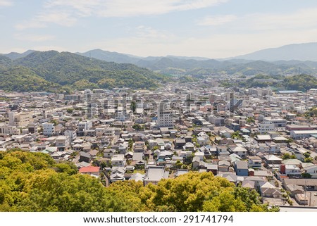 SHIKOKUCHUO, JAPAN - MAY 22, 2015: View of Kawanoe town from Kawanoe castle in Shikokuchuo city, Shikoku Island, Japan. Shikokuchuo is the leading producer of paper and paper products in Japan