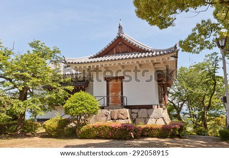 SHIKOKUCHUO, JAPAN - MAY 22, 2015: Watch tower of Kawanoe castle in Shikokuchuo city, Shikoku Island, Japan. Castle was erected in 1337, reconstructed in 1984