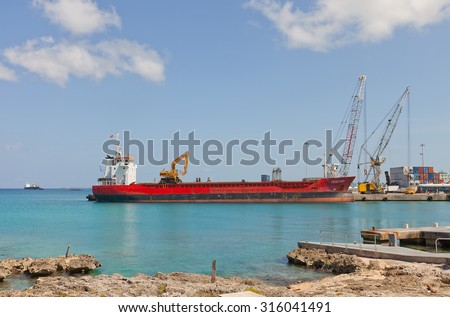 GEORGE TOWN, CAYMAN ISLANDS - SEPTEMBER 12, 2015: Monstein general cargo ship (1996, IMO 9100176) in the port of George Town of Grand Cayman, Cayman Islands (British Overseas Territory)