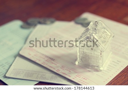 Business concept of home loan with book bank statement in vintage style