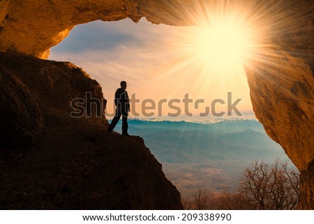 beautiful  man  mainsail  and cave mountains background, adventure hobby extreme tracking amazing  fresh  fantastic
