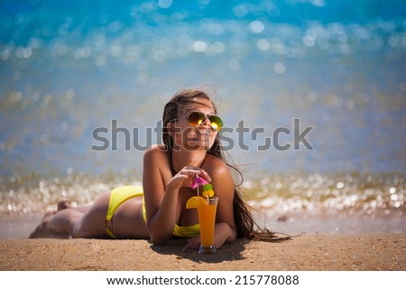 beautiful brunette woman yellow swimsuit blue sea drink cocktail