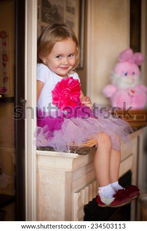beautiful  smiling  little blonde girl  in pink skirt on home background fresh trendy summer spring joy happy look cute studio impressions lady