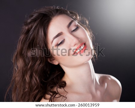 beautiful elegance lady smiling joy fun woman face with brown eyes, studio portrait and professional light, nature romantic wellness pure makeup, gloss  hair brunette, white teeth, black background