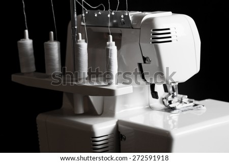 beautiful background sewing electric machine overlock woman leisure lifestyle, shallow depth of field